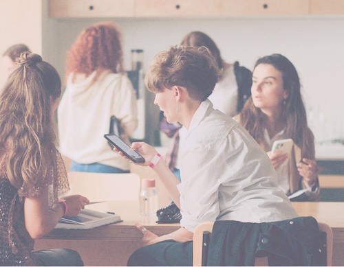 Young professionals collaborating with digital devices in a modern workspace